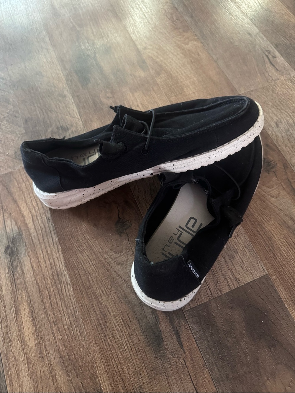 Hey Dude Women’s Black Canvas Slip-On Sneakers with White Speckled Sole